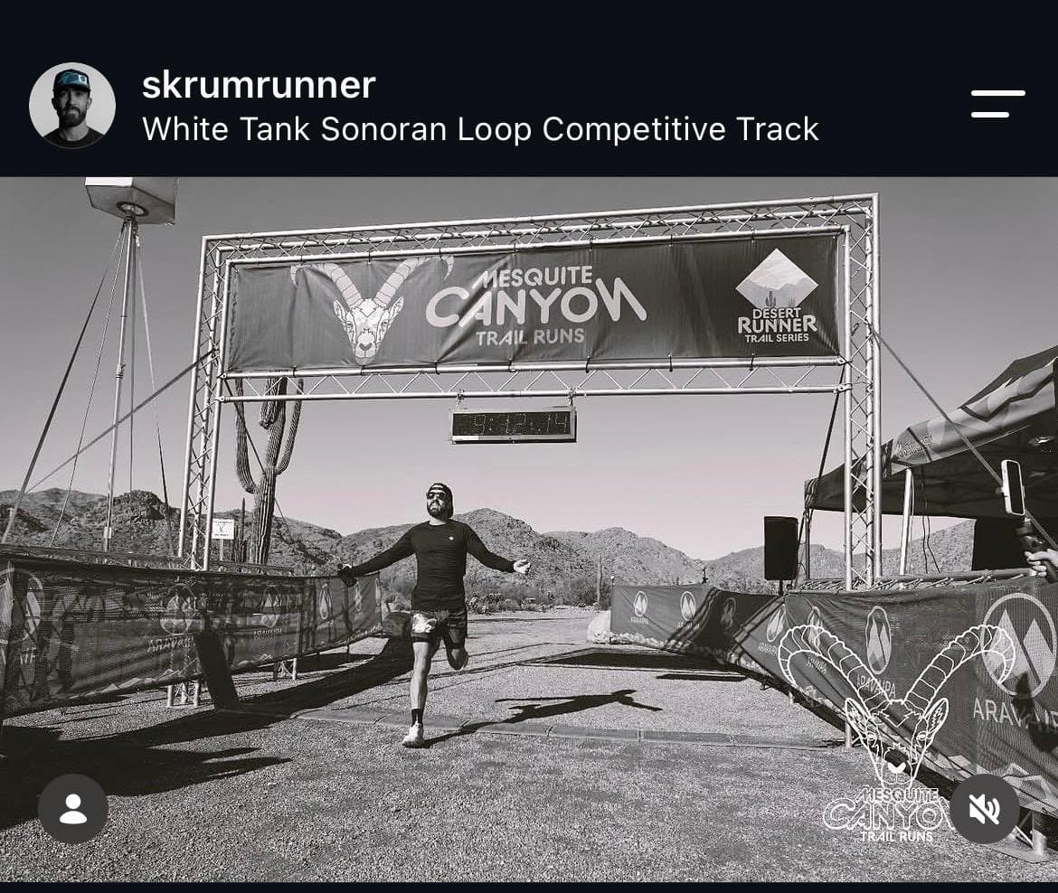 Kurt coming through the finish arch at Mesquite Canyon Trail Runs